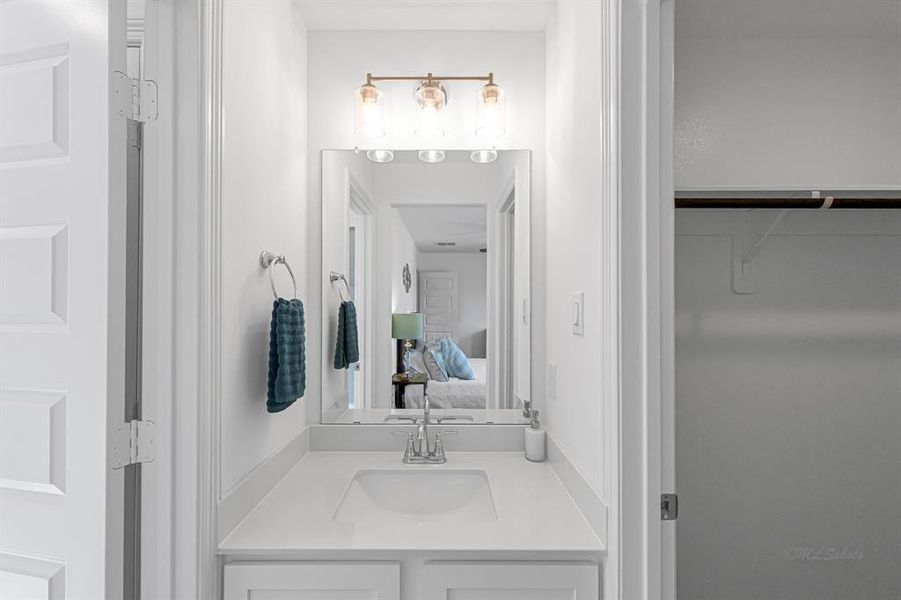 This end of the hollywood style bathroom, with shower to the left and walk-in closet to the right.