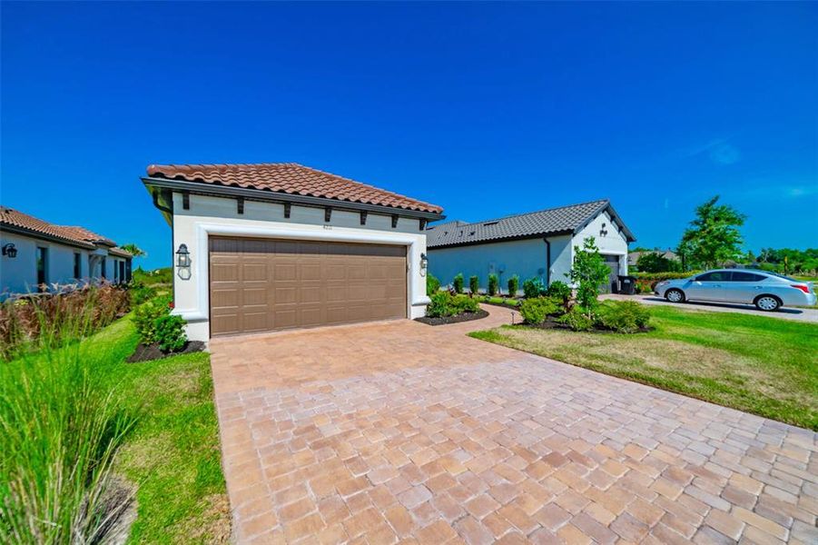 Brick pavered driveway and front walk