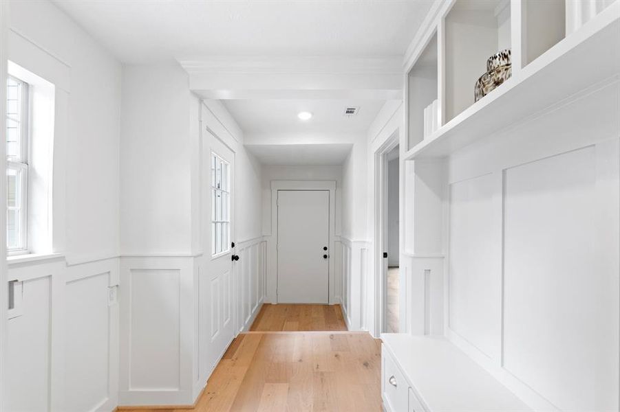 This full mud and laundry area has been intricately finished with simple wainscoting detail. You have direct access from your driveway into this space making it the perfect drop off zone area.