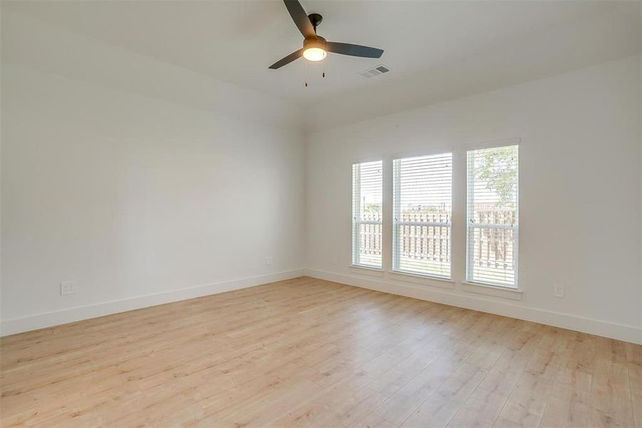 Unfurnished room featuring light hardwood / wood-style floors and ceiling fan