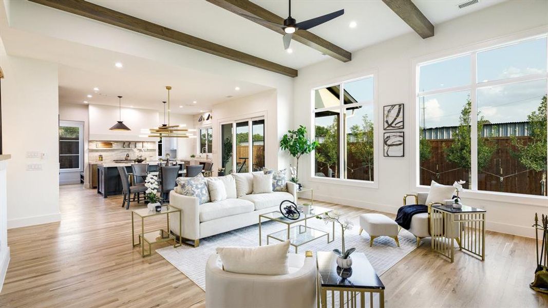 Living room with light hardwood / wood-style floors and a wealth of natural light