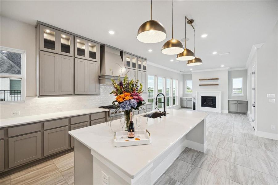 The Chef's Kitchen offers a gorgeous island with granite counters, stainless appliance, a double-oven, a huge walk-in pantry, and a gas cooktop.