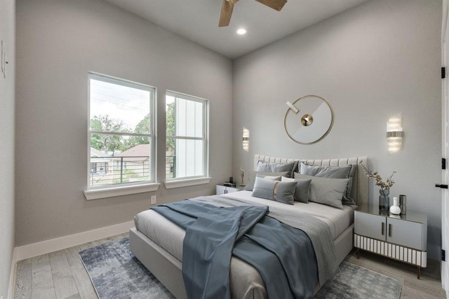 Bedroom featuring hardwood / wood-style flooring and ceiling fan