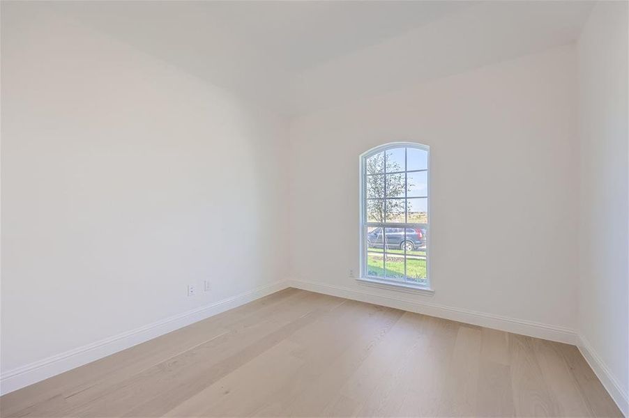 Spare room featuring hardwood / wood-style flooring