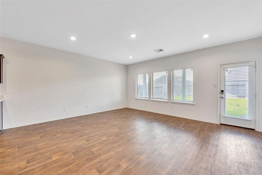 This spacious and open canvas is the living room and it overlooks a nice sized backyard.