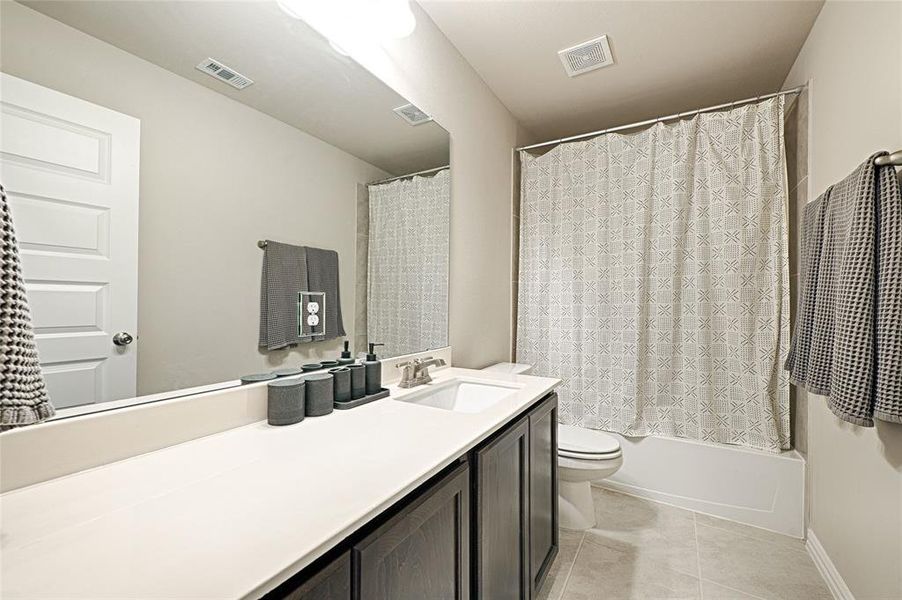 Full guest bathroom upstairs with tub-shower combo