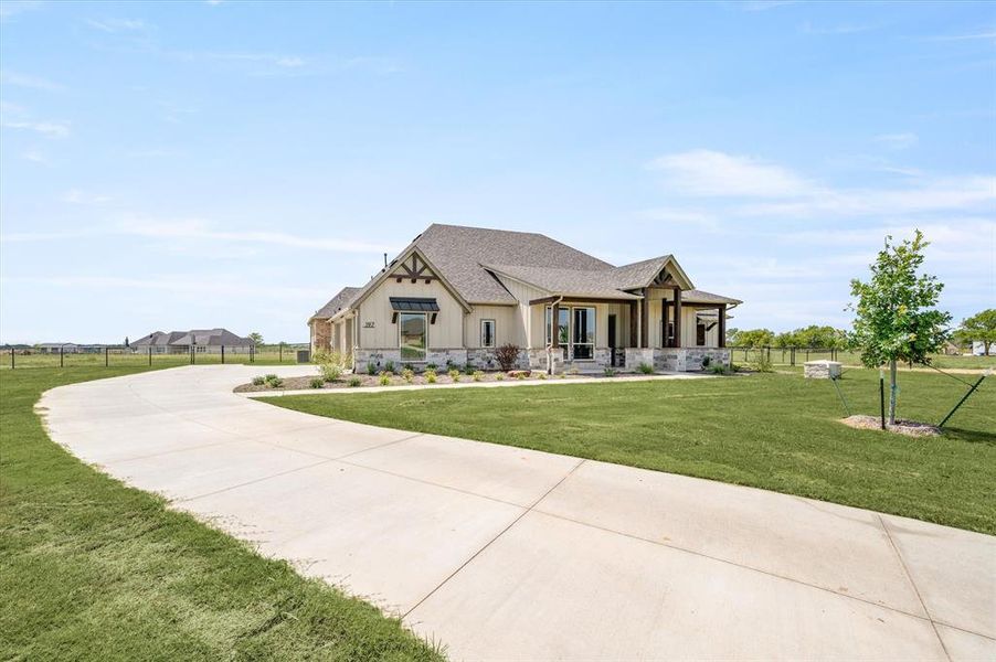 Craftsman-style home with a front yard