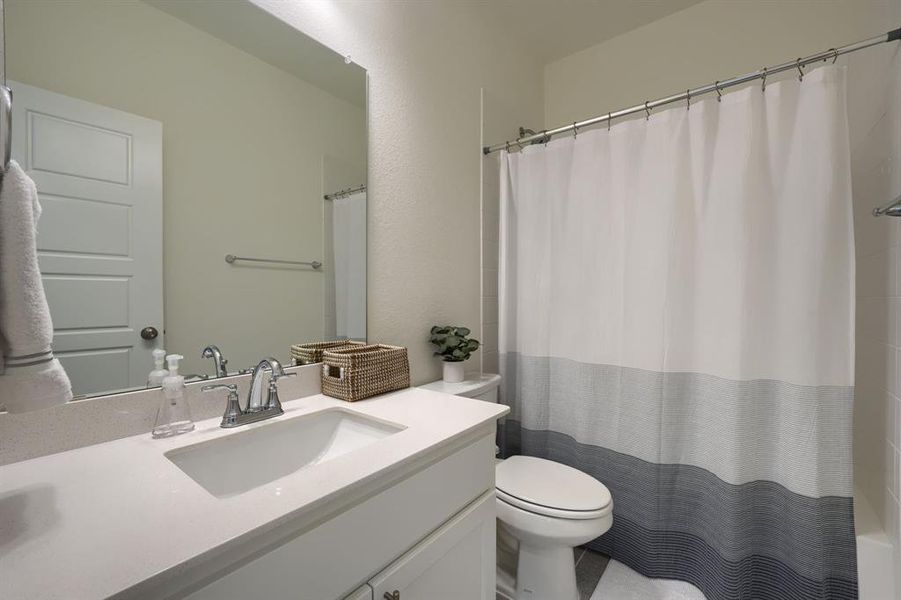 Bathroom with toilet and oversized vanity