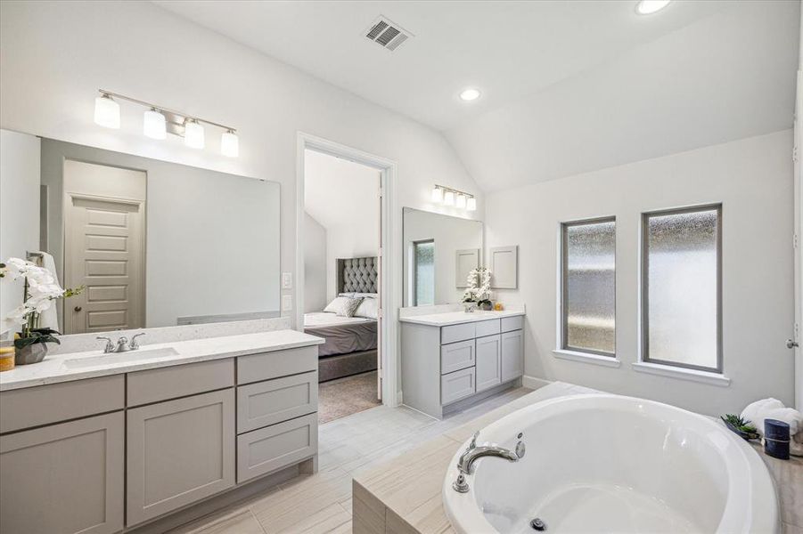 Having double vanities in the primary bath is a thoughtful touch that adds both functionality and convenience to the space. It provides ample room for two people to have their own designated areas for grooming and getting ready, allowing for a more harmonious morning routine.