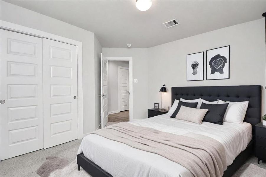 Spacious secondary bedrooms with large windows, neutral paint, and plush carpet. Sample photo of completed home. Actual color and selections may vary.