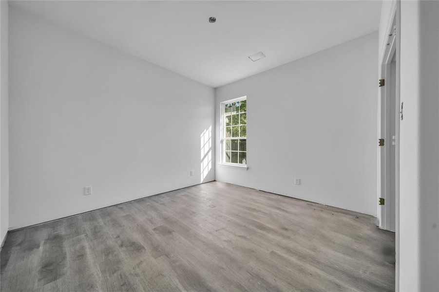 Spare room with light hardwood / wood-style flooring