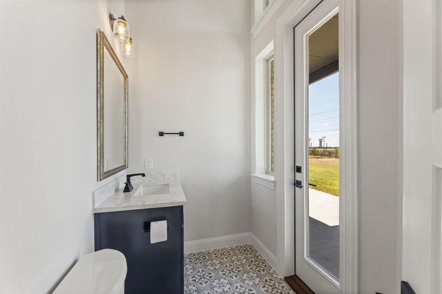 Bathroom featuring vanity and toilet