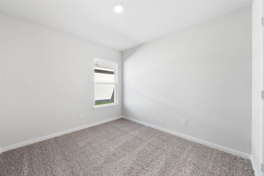 Unfurnished room featuring carpet