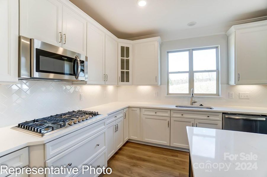 This home will have a Designer Range Hood and wall-oven/microwave combo