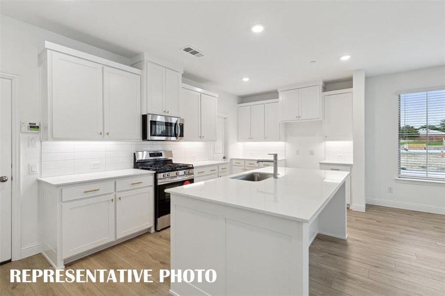 Gorgeous cabinetry paired with stylish finishes can be found in your new dream kitchen!  REPRESENTATIVE PHOTO