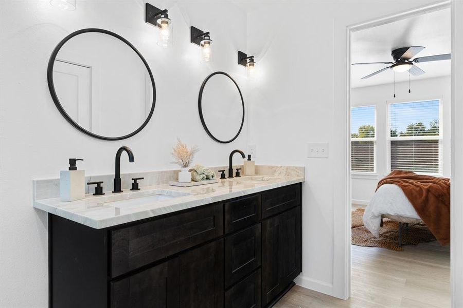 Bathroom with vanity and hardwood / wood-style flooring