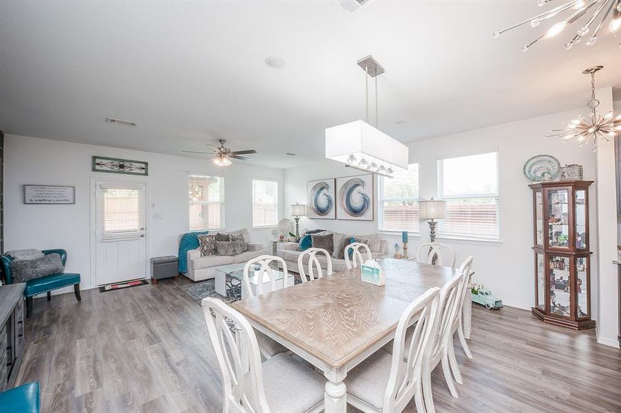 Adjacent to the kitchen is the formal dining room.  The seller added the stylish lighting fixture directly centered over where the table should go.