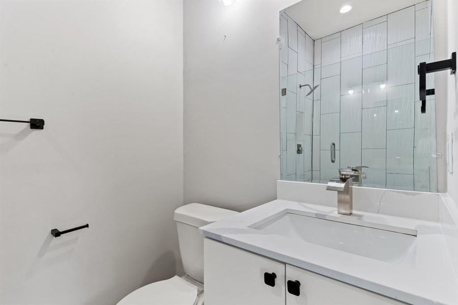 Bathroom featuring vanity and toilet