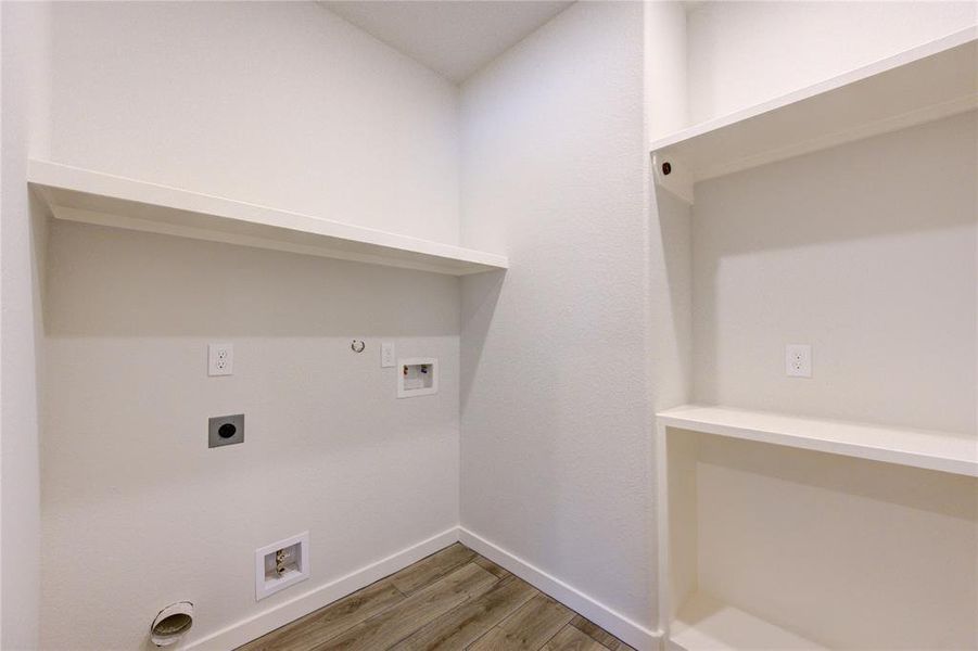 Utility room is very functional. Check out the built-in shelves