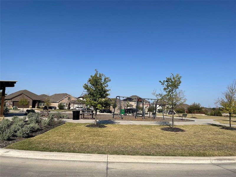 Surrounding community with a gazebo, a yard, and a playground