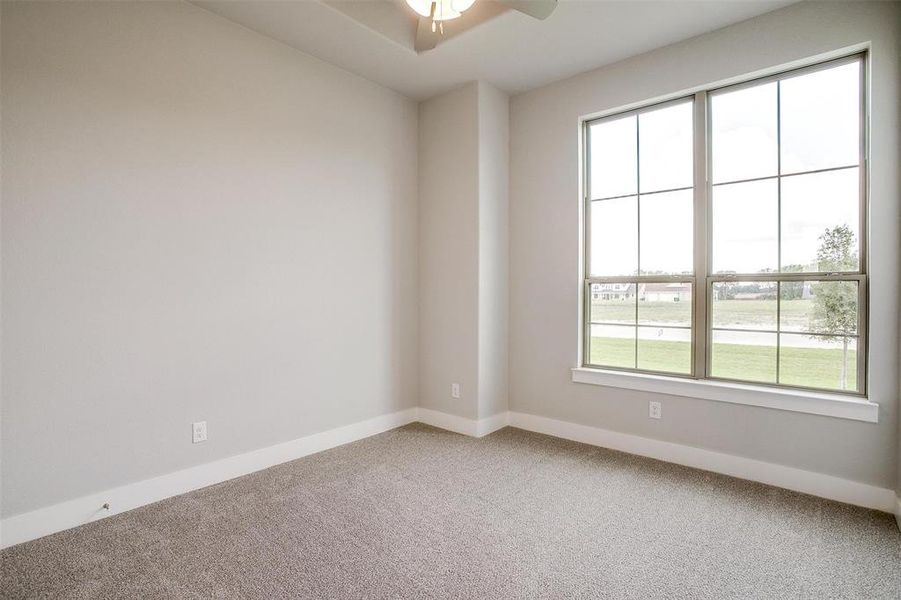 Unfurnished room with carpet and ceiling fan