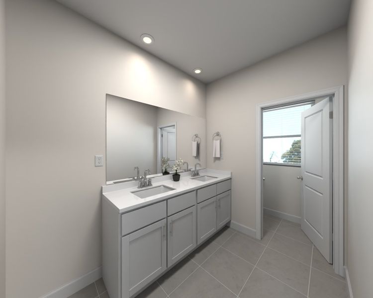 The primary suite boasts a private ensuite with dual sinks.