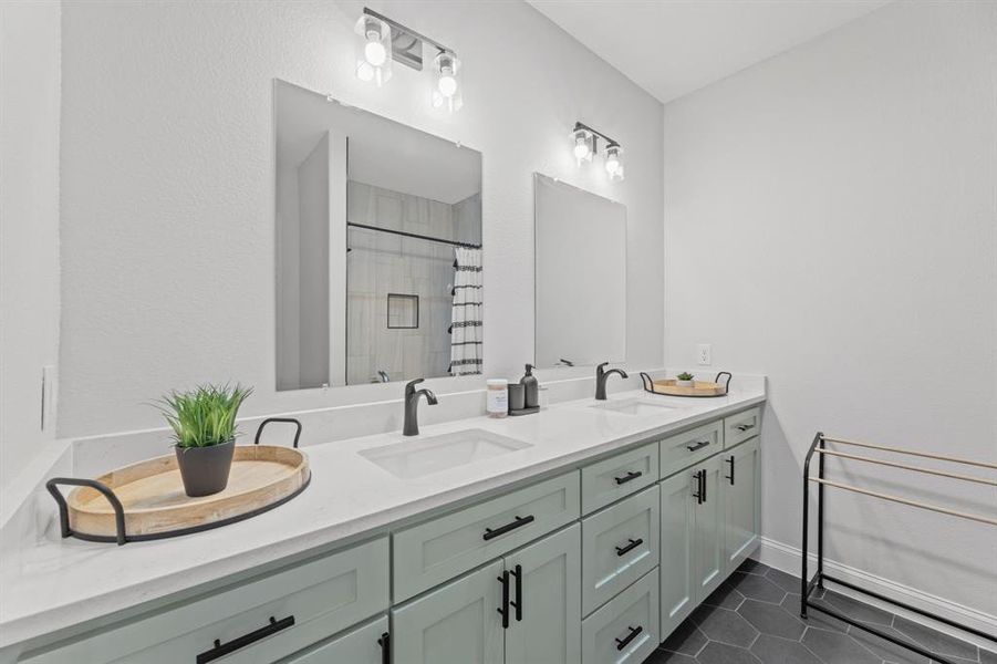 Bathroom with vanity, tile patterned floors, and walk in shower