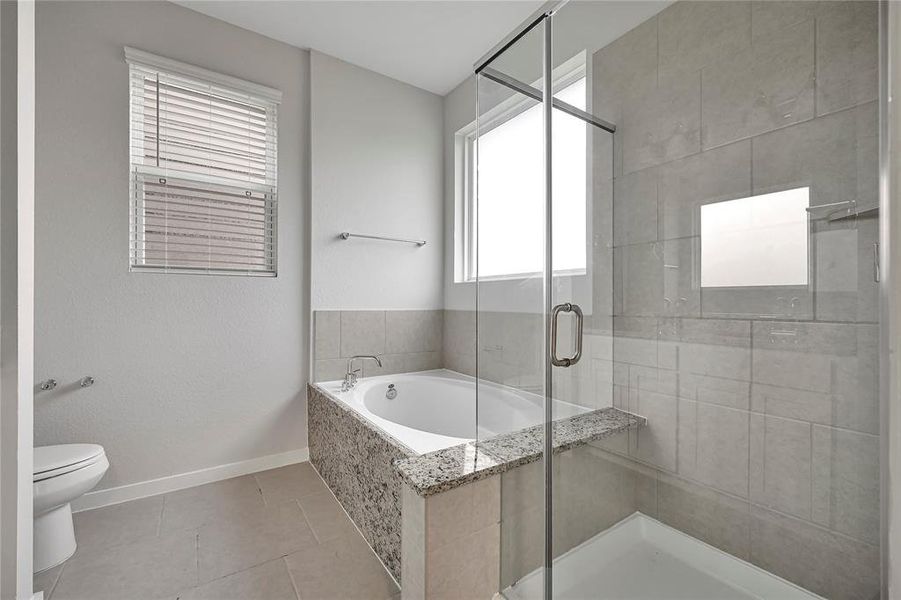 Primary bath with separate tub and shower