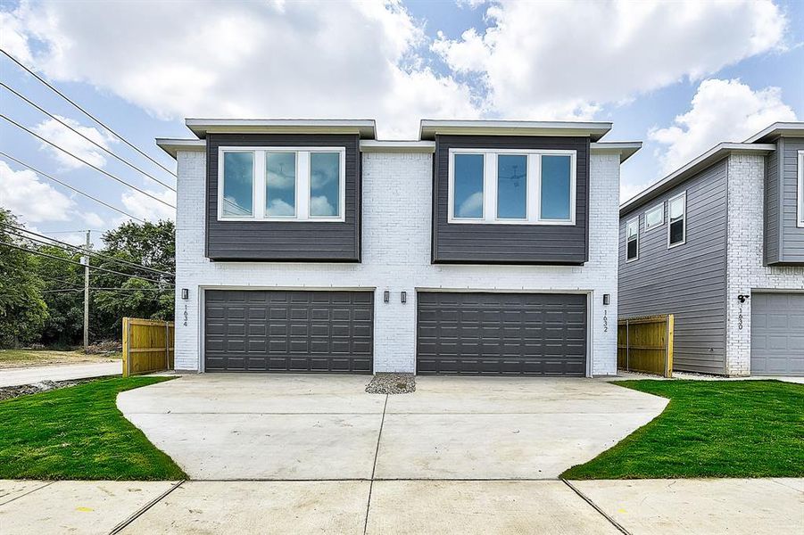 View of front of property featuring a garage