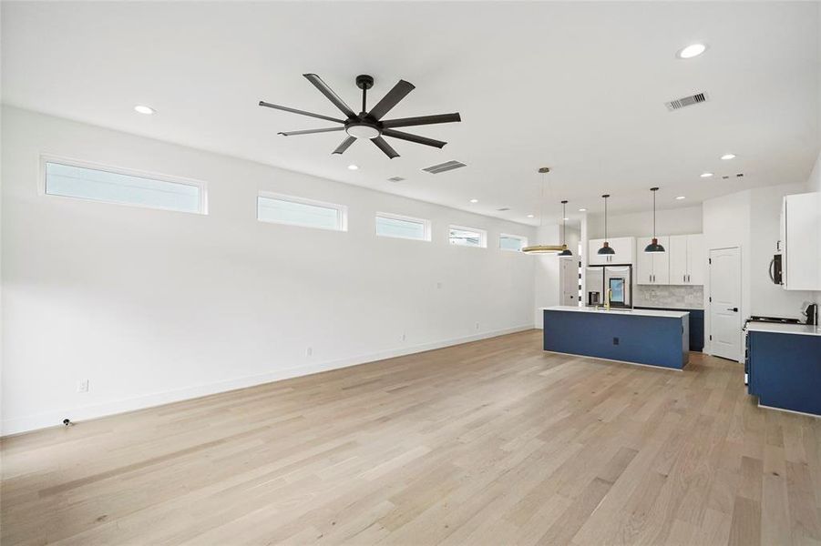 Flooded with natural light, the family room's elevated windows create a bright and airy ambiance.