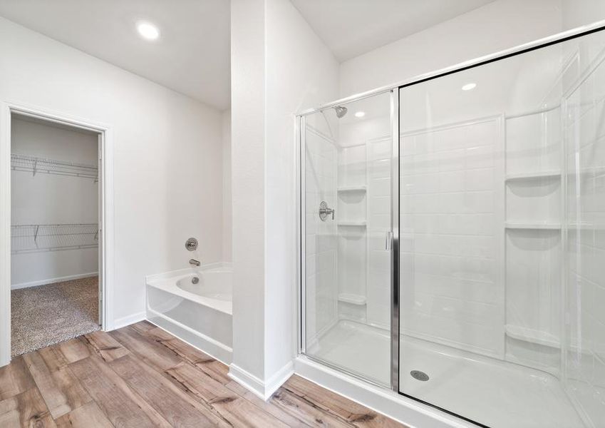 The master bathroom of the Cypress has a garden tub and a glass, walk-in shower.