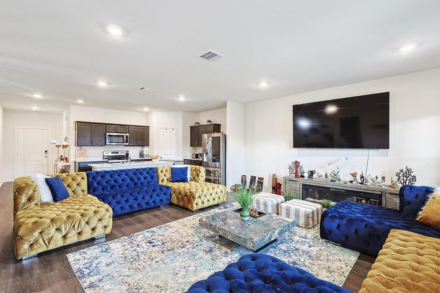 Living room with dark hardwood / wood-style floors