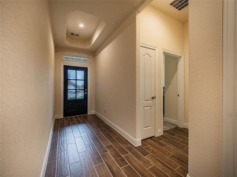 As you enter this superior one story home is just like walking into a model home, you have your beautiful tile floors, wood front door and tiered ceiling