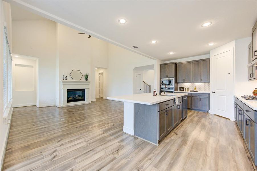 Open concept living and kitchen area, perfect for entertaining guests.