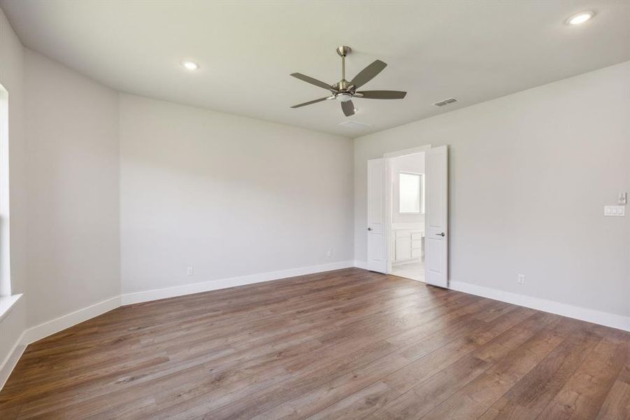 Spare room featuring light hardwood / wood-style floors and ceiling fan