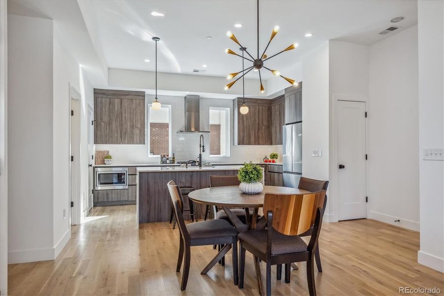 Spacious Dining/Kitchen Eating Area. Modern Lighting.