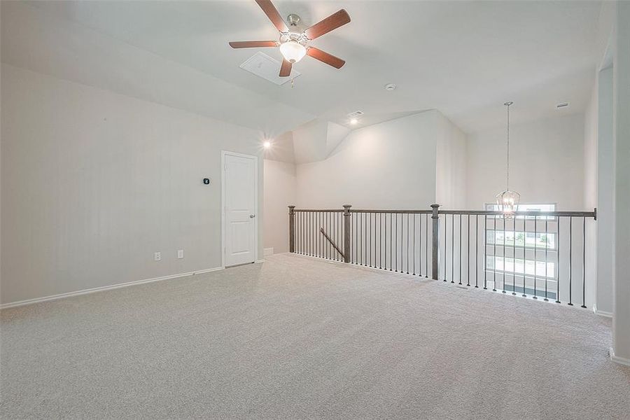 A spacious game room awaits, complete with a balcony overlooking the family room and foyer.