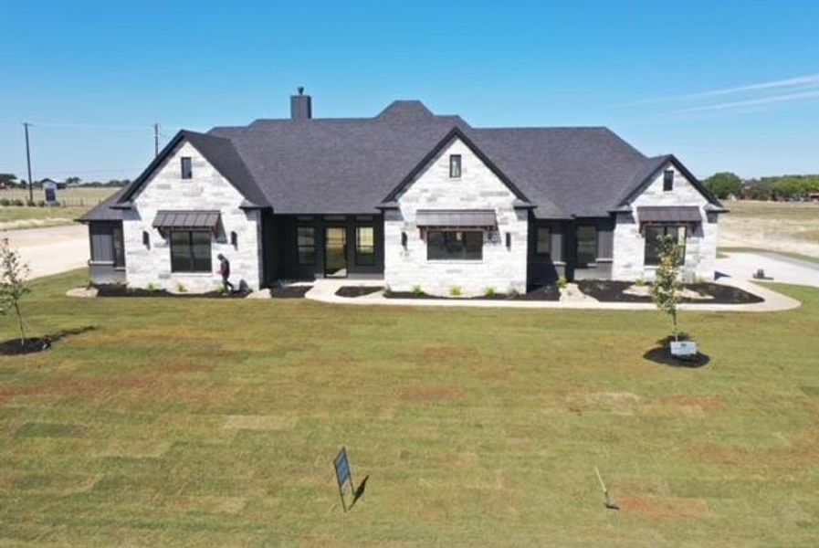 View of front of house with a front lawn