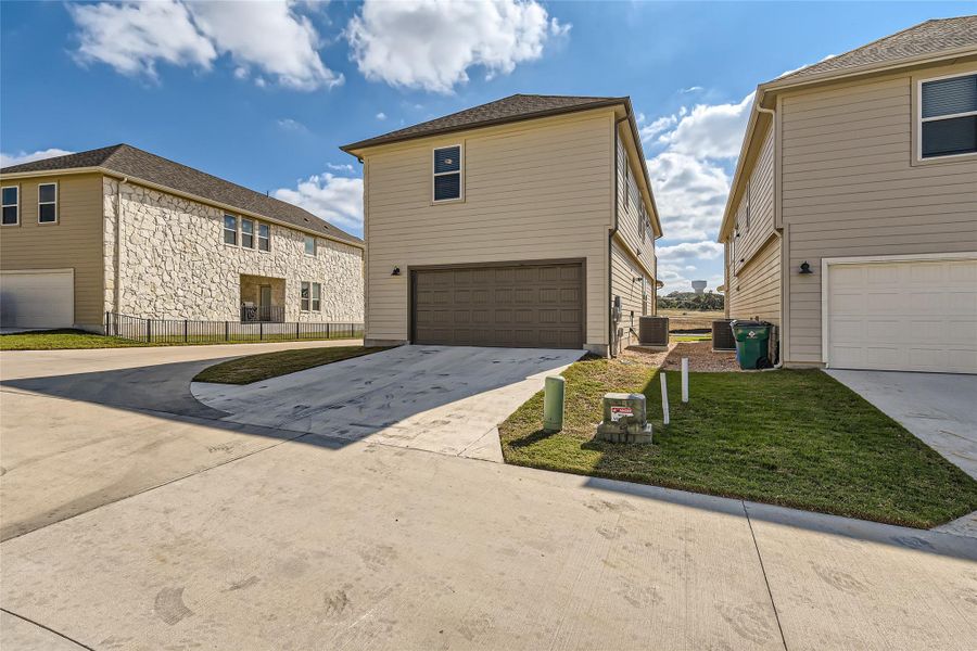 The lawn surrounding the home comes with automatic irrigation for easy maintenance.