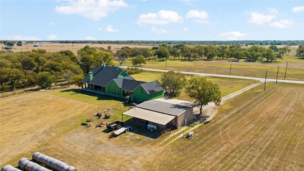 Birds eye view of property featuring a rural view