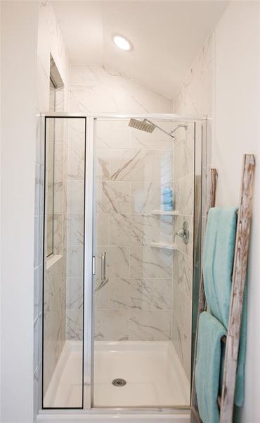 Bathroom featuring a shower with shower door