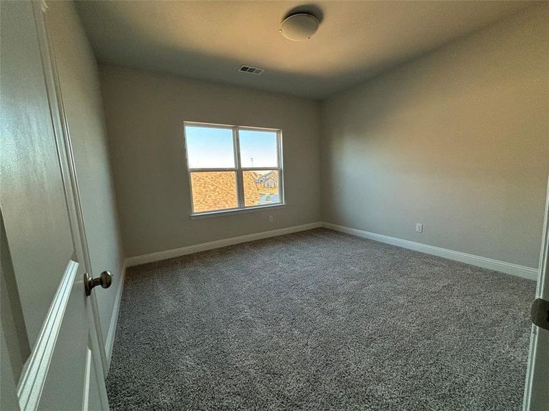 Spare room with carpet floors