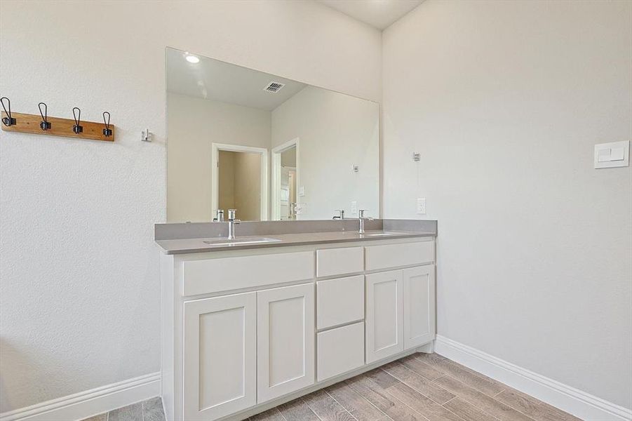 LARGE Ensuite bathroom with dual sinks, quartz countertops, separate shower, large soaking tub and LARGE walk in closet