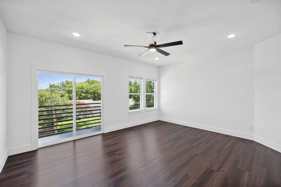 Spare room featuring dark hardwood / wood-style floors and ceiling fan