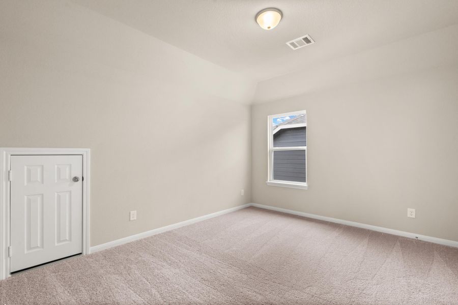 Secondary bedroom. Note: Sample product photo - actual exterior and interior selections may vary by homesite