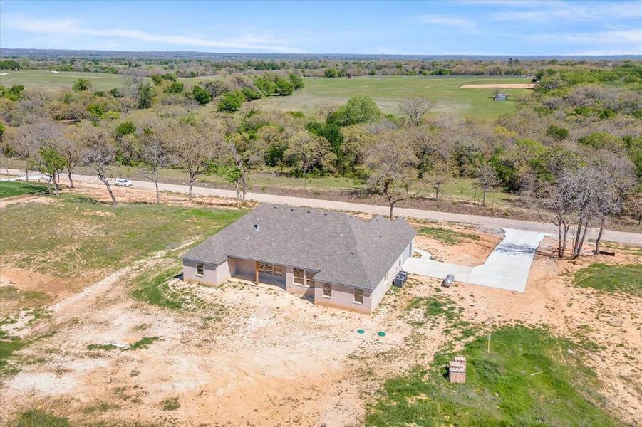 Birds eye view of property featuring a rural view