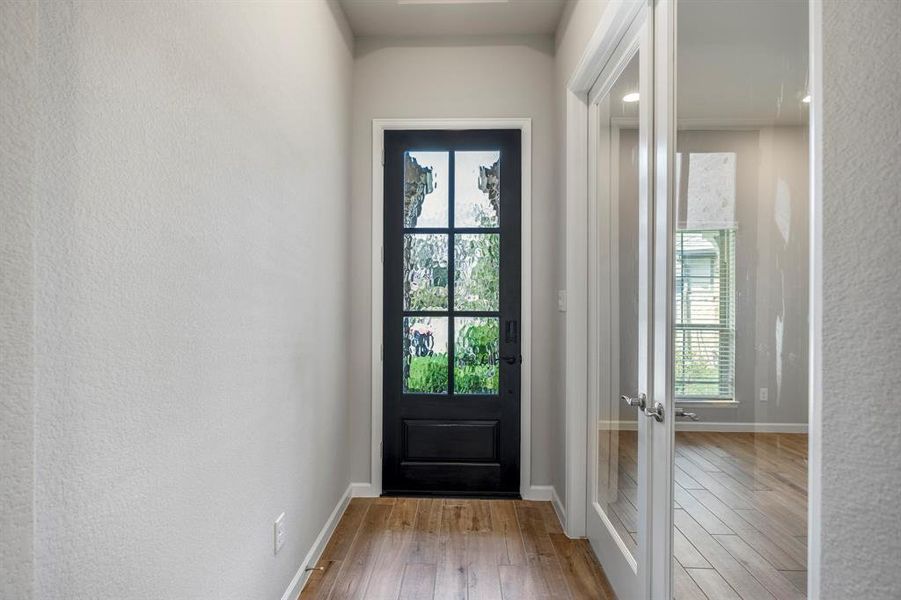 Private home office just off the entry behind beautiful glass french doors