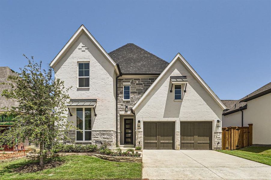 View of front of property with a garage