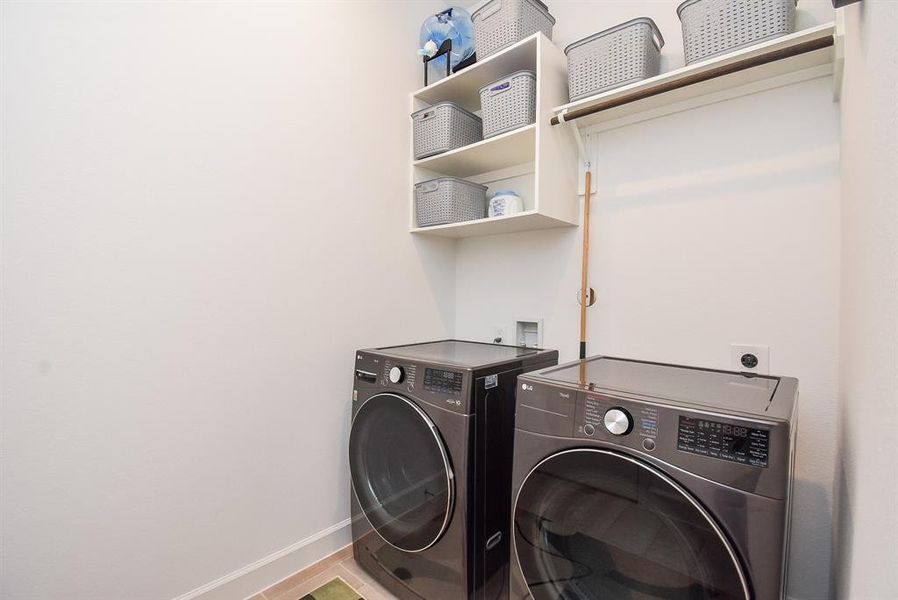 Utility room, washer and dryer stay.