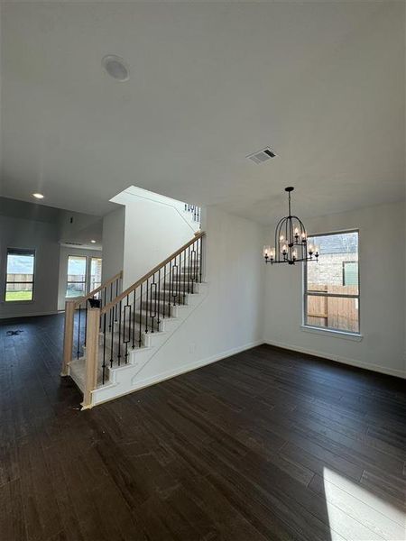 HOME IN PROGRESS - This dining room is equipped with a stunning chandelier making it a perfect space for everyday meals!